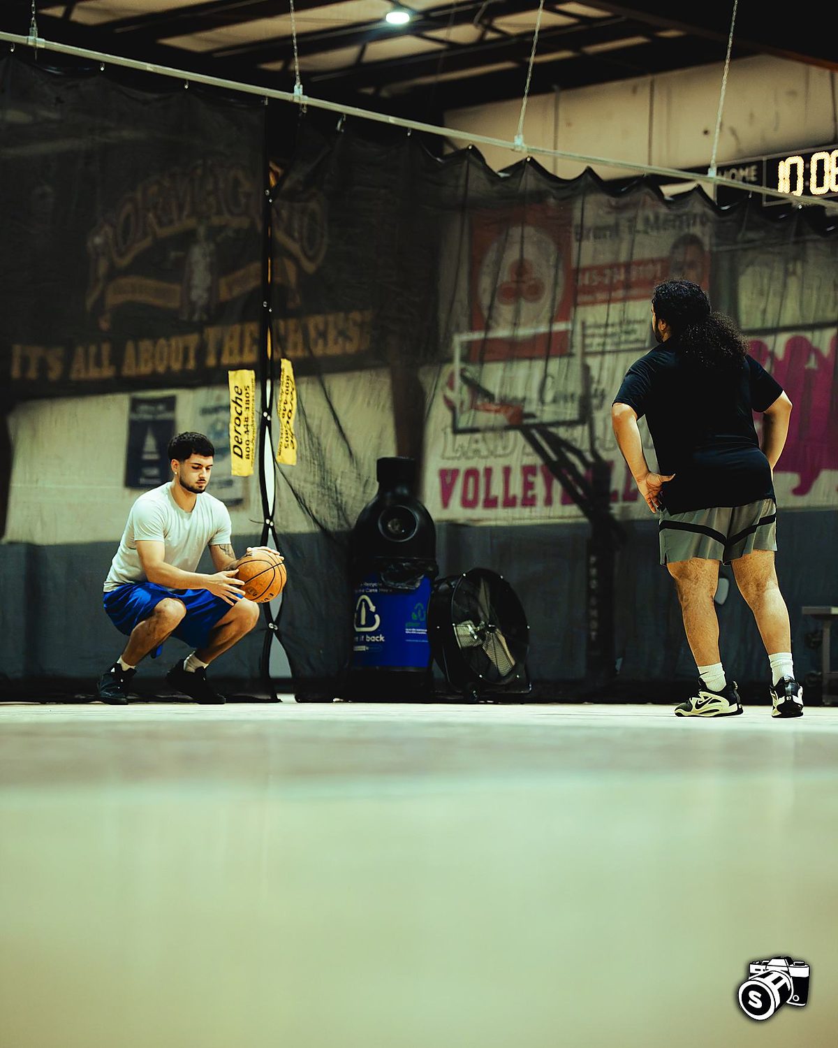 Coach and athlete in a defensive stance drill